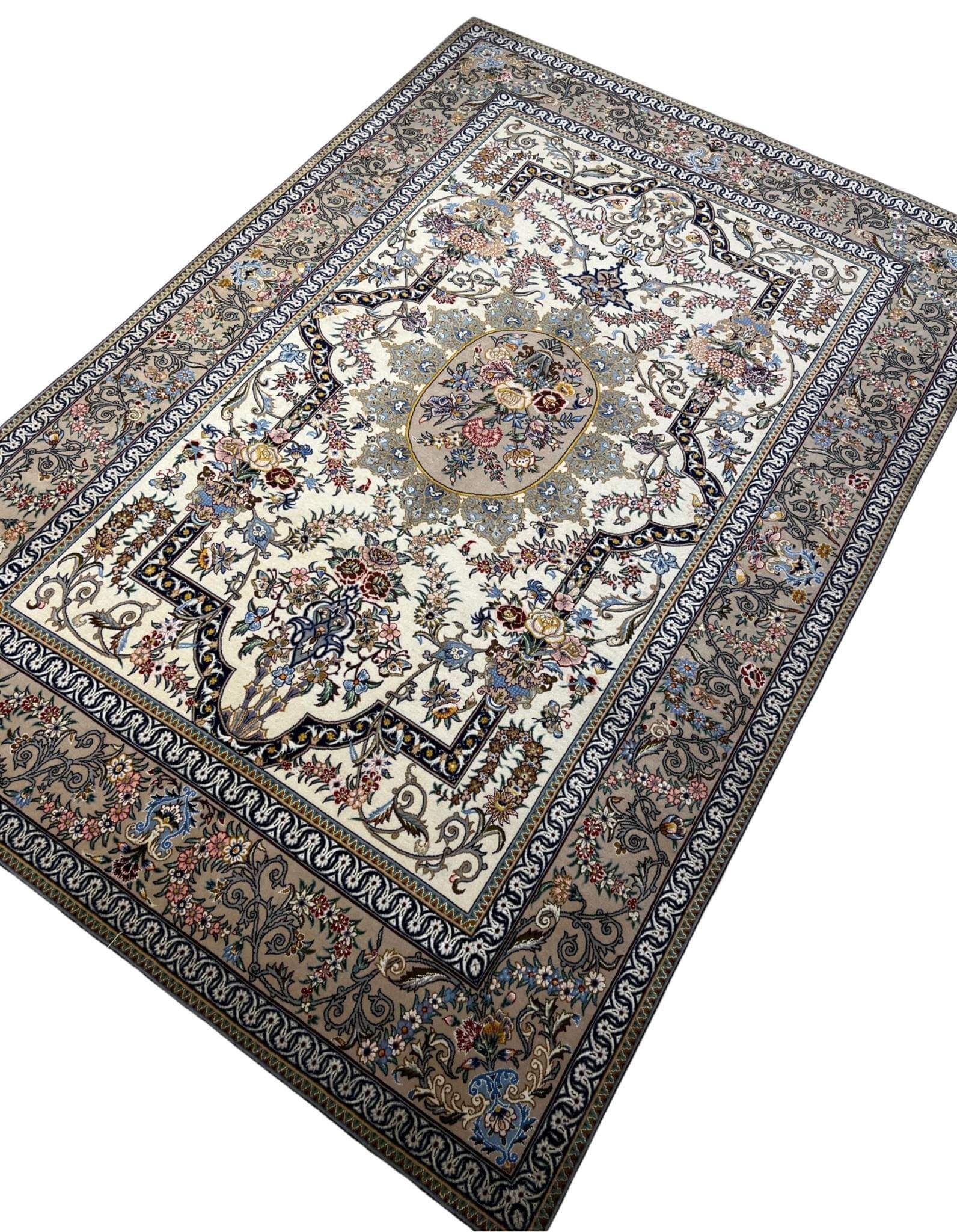 "Isfahan hand-knotted rug with a floral medallion centerpiece and ornate border design."